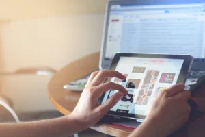 a woman looking at a laptop